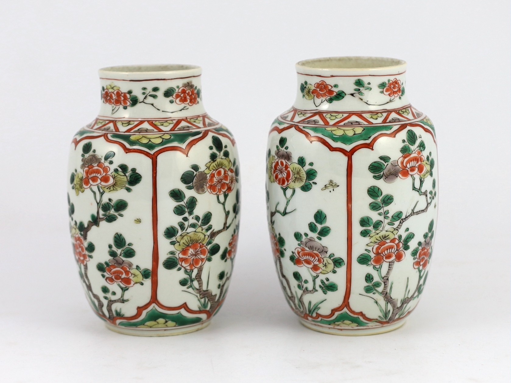 A pair of Chinese famille verte small jars, Kangxi period, 15.5cm high, rim crack